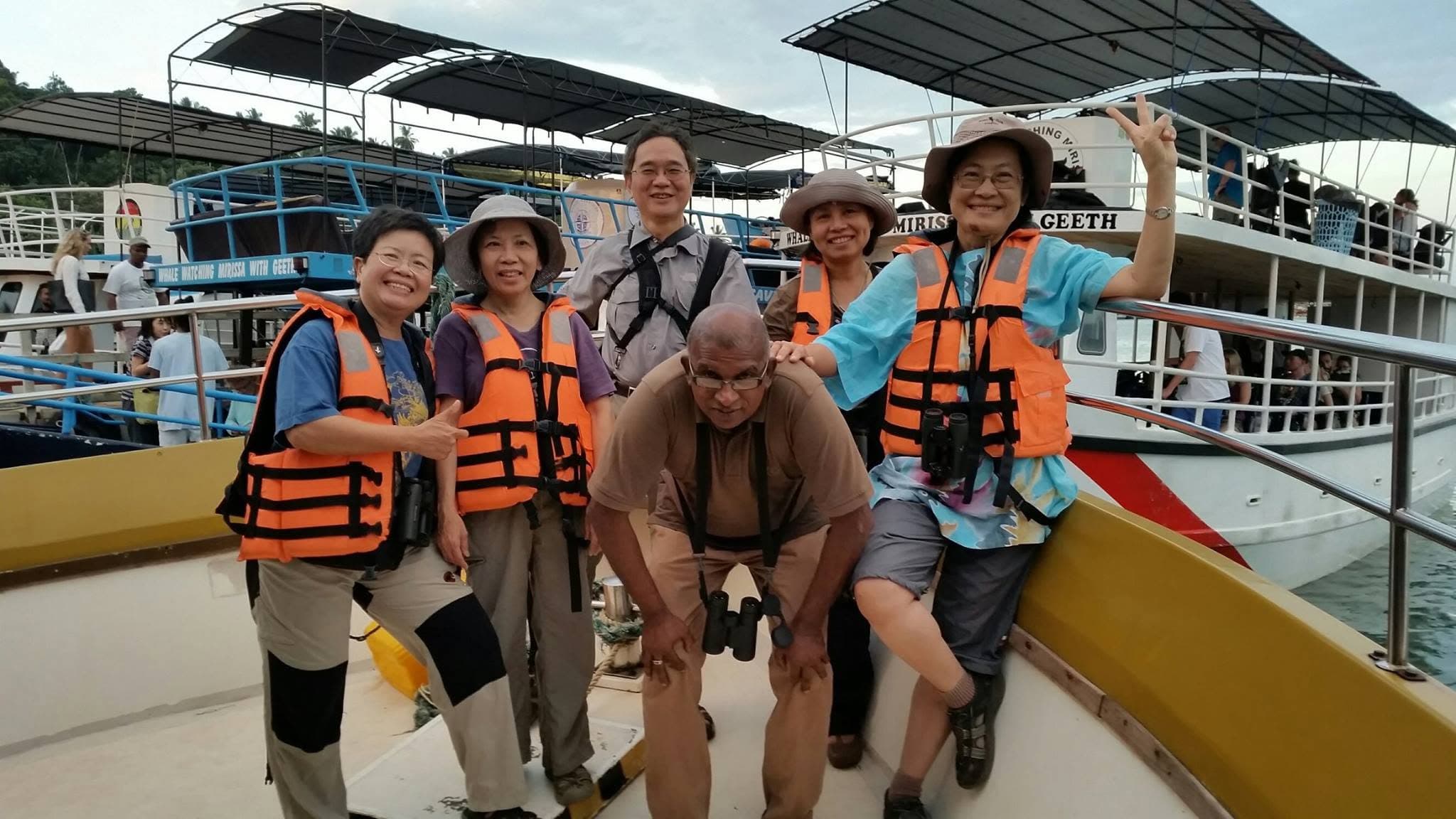 The Wildscape guide with a group of guests aboard a boat during a whale-watching excursion at Mirissa